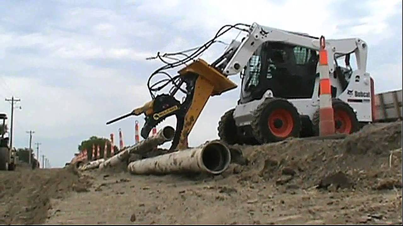 Mul T Rex multi-function skid loader attachment.