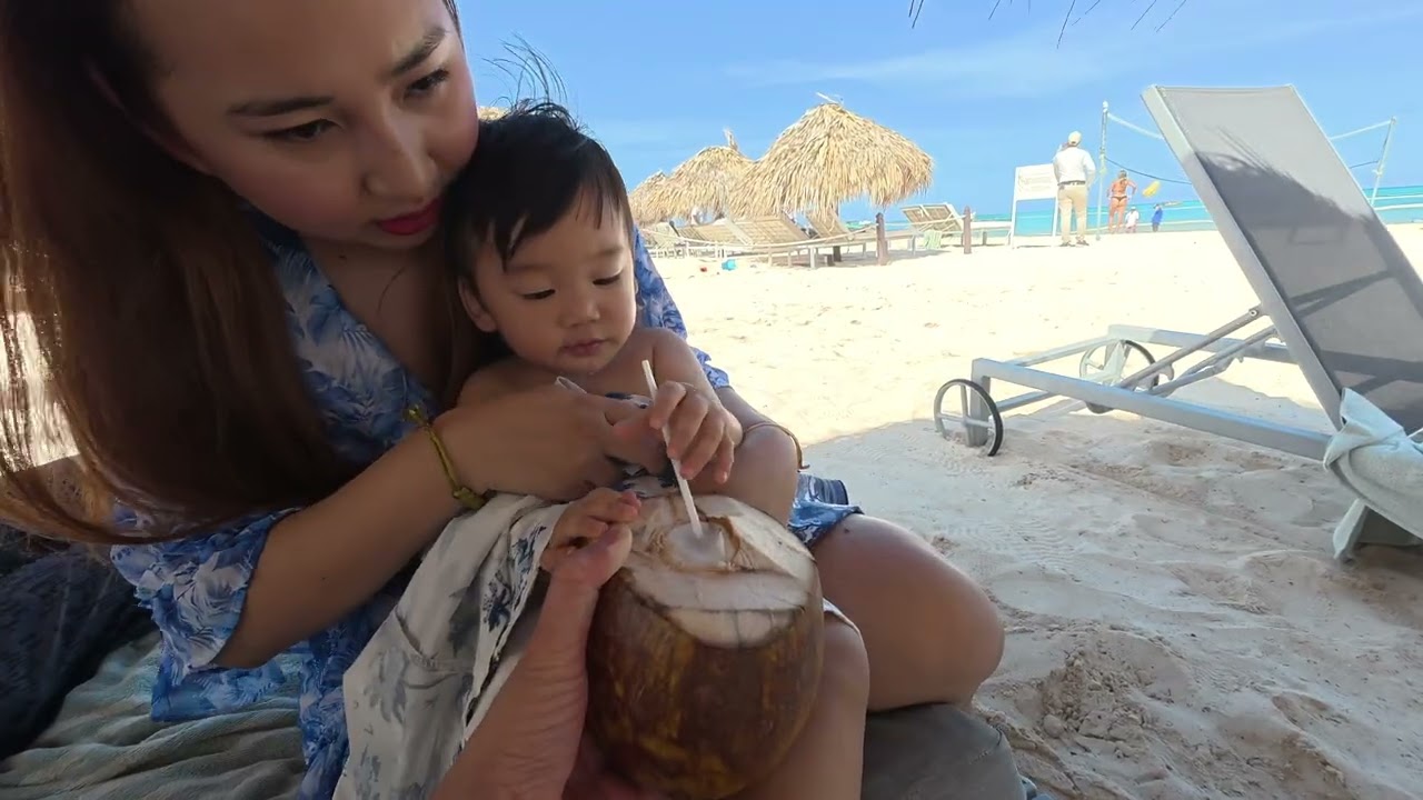 Buying coconuts, Bracelets & Beach Vendors in Punta Cana