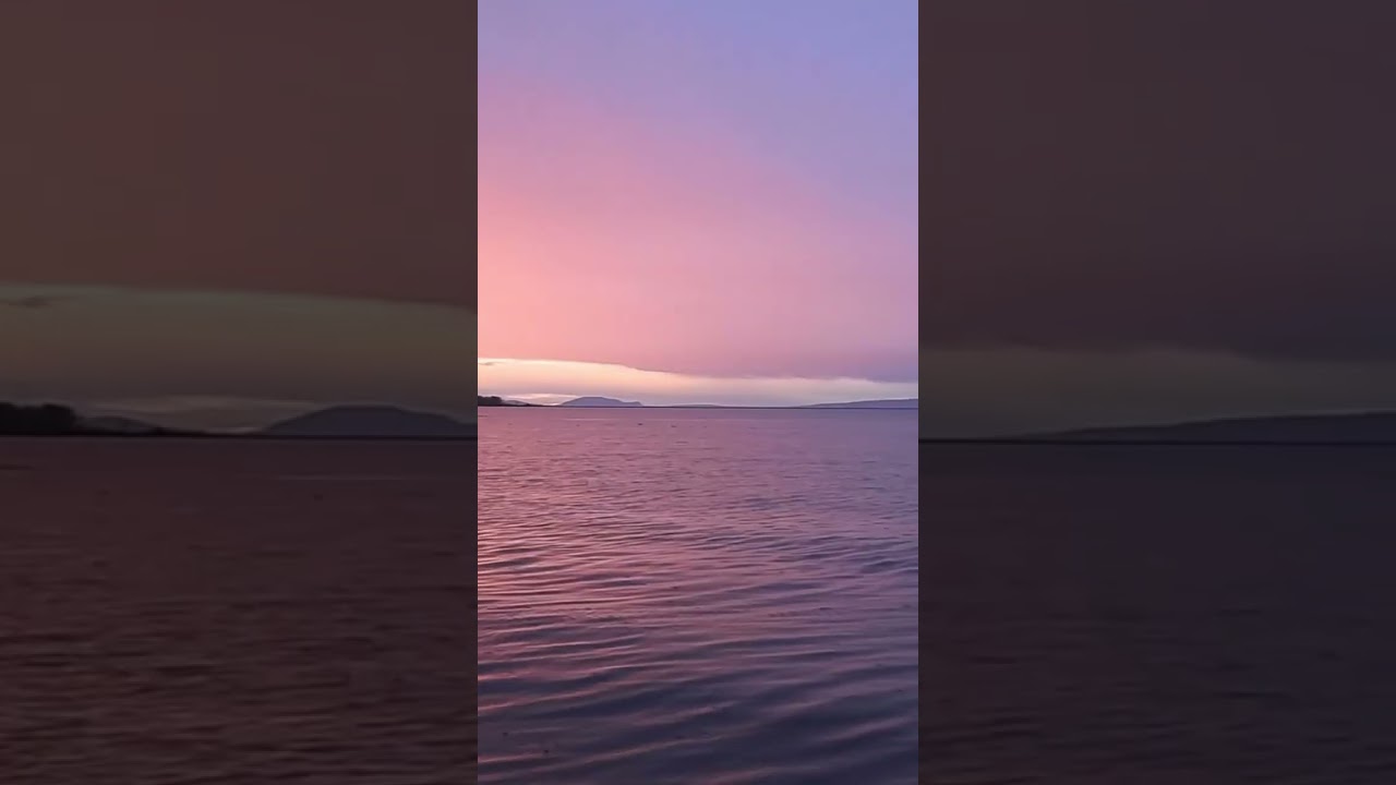 Sunrise and a double rainbow at Deltaport