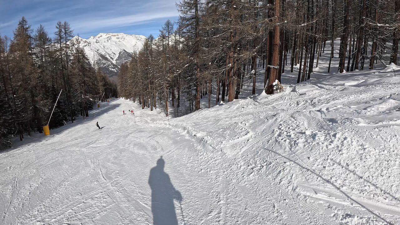 Skiing in Broad Sunlight on the Mountains in Italy
