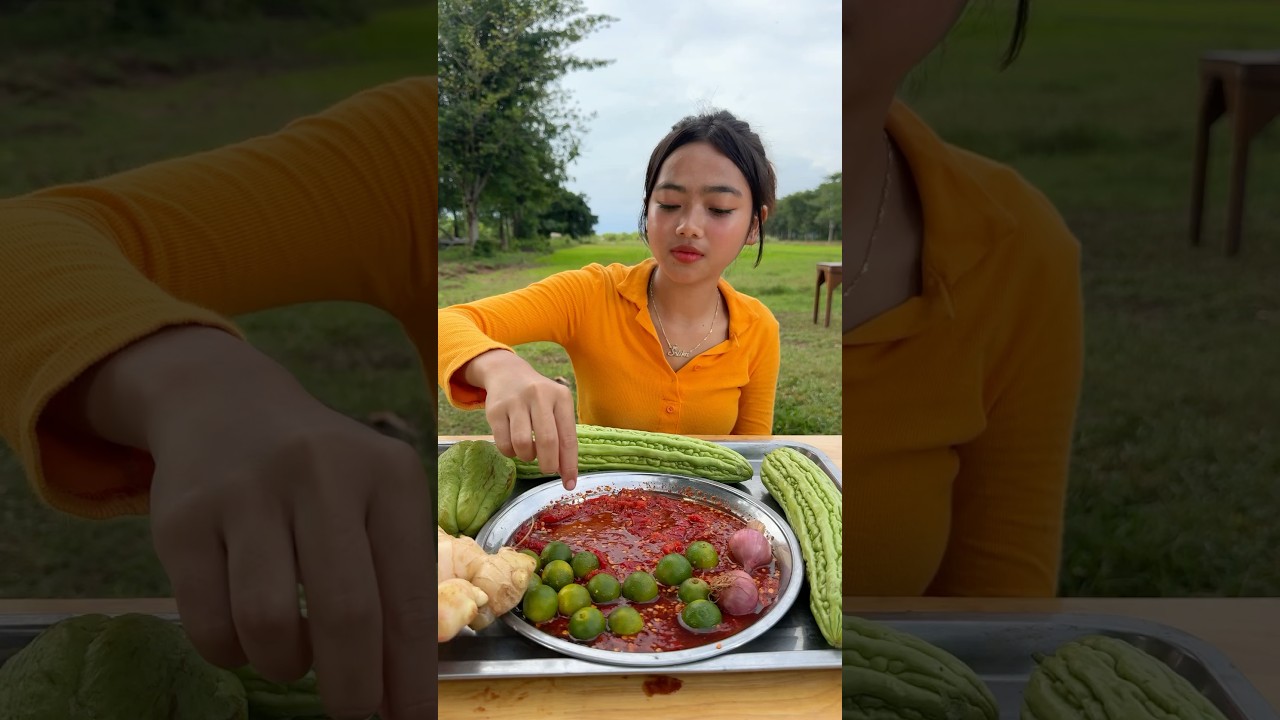 Eating green lemon with chili salt 