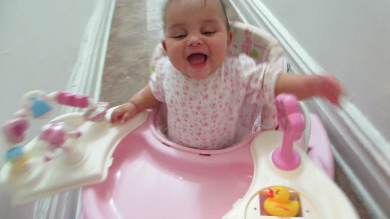 6 month CUTE baby runs in a walker