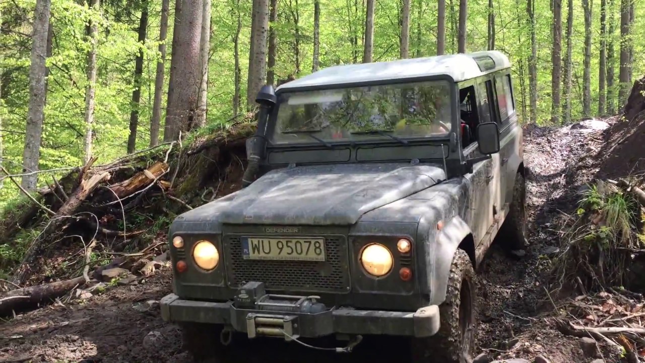 Land Rover Defender 110 mud on logging road somewhere in Romania