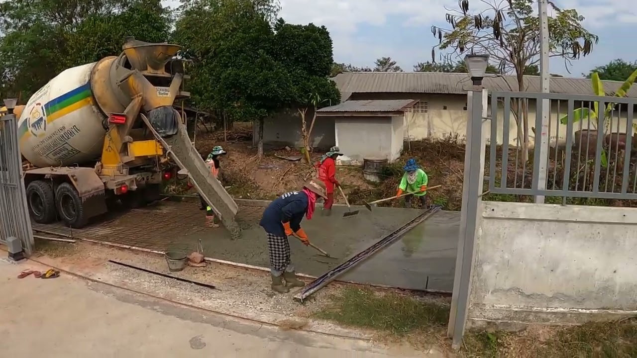 Thailand - Getting our street paved by the local government.