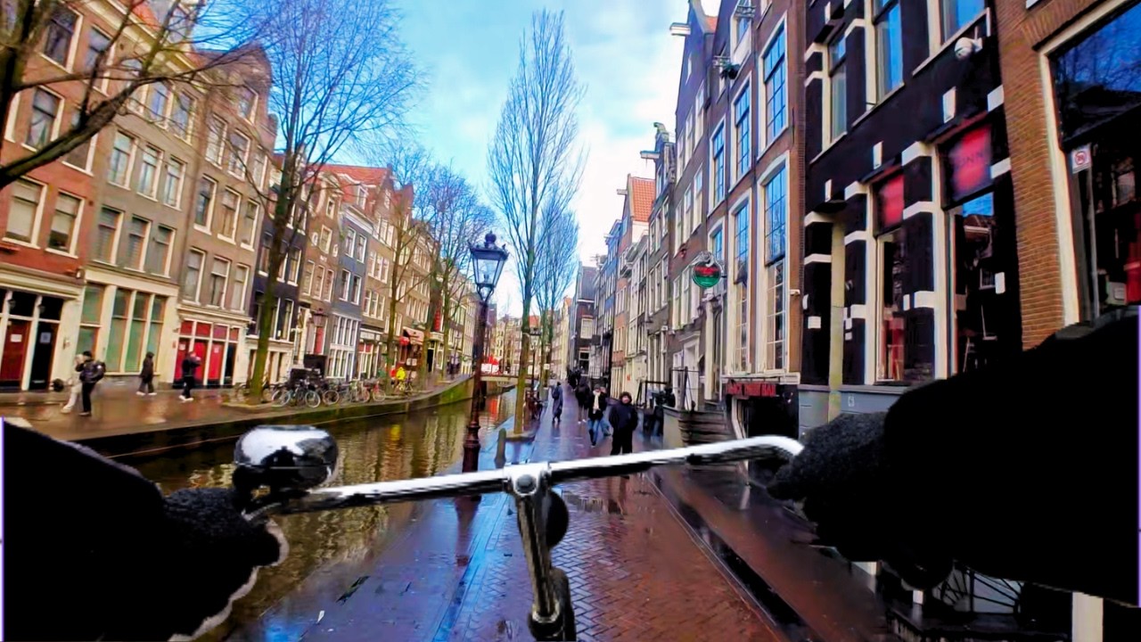 Just cycling along the canals of Amsterdam | Sunny/cloudy weather