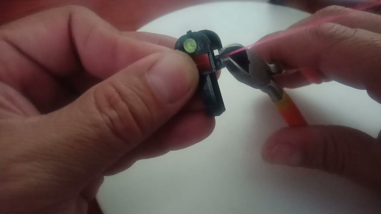 Colocación de fibra a mira de resortera.