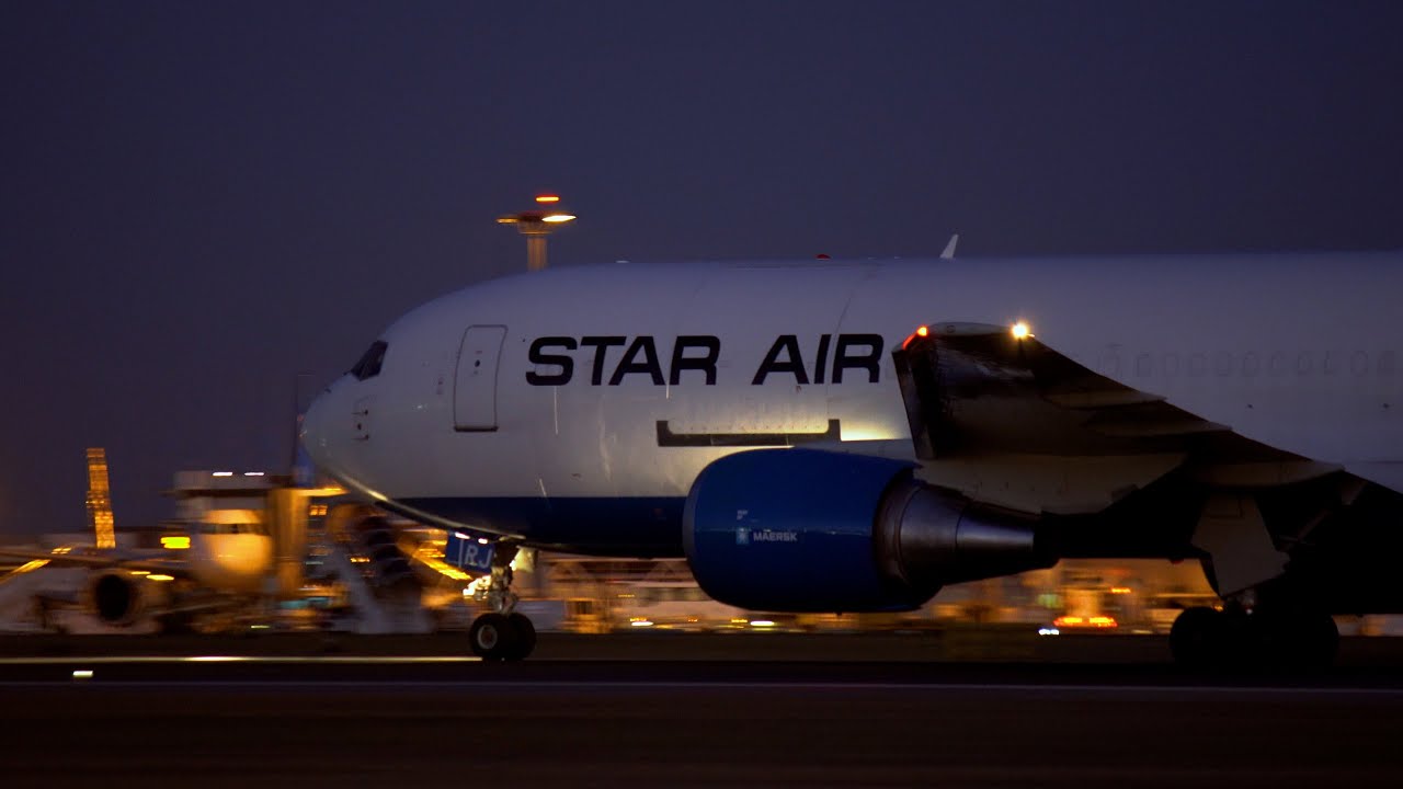 Star Air (Maersk Air Cargo) Boeing 767-200 night take off from Lisbon Airport LPPT