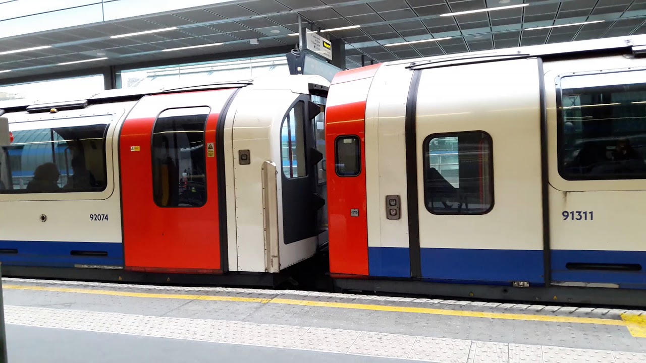 London Underground Central Line: 1992 Tube Stocks #91311 & #92074 leaving Stratford