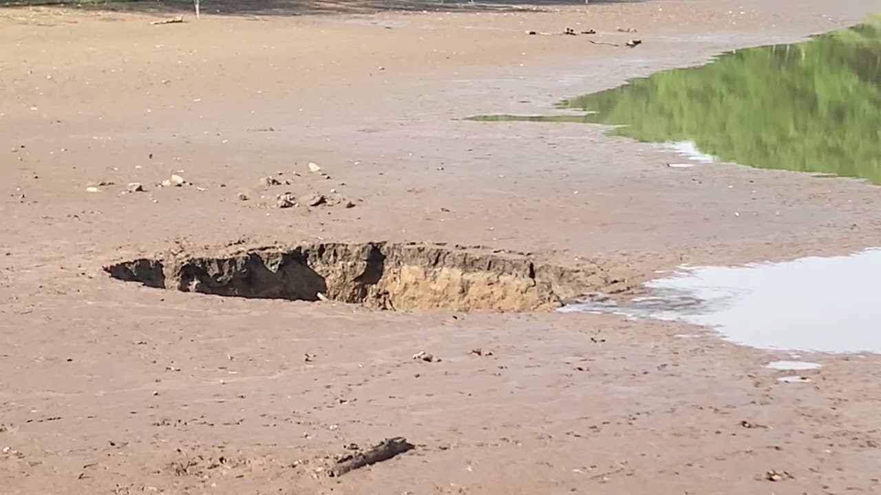 Sinkhole partially drains lake at Lone Elk Park