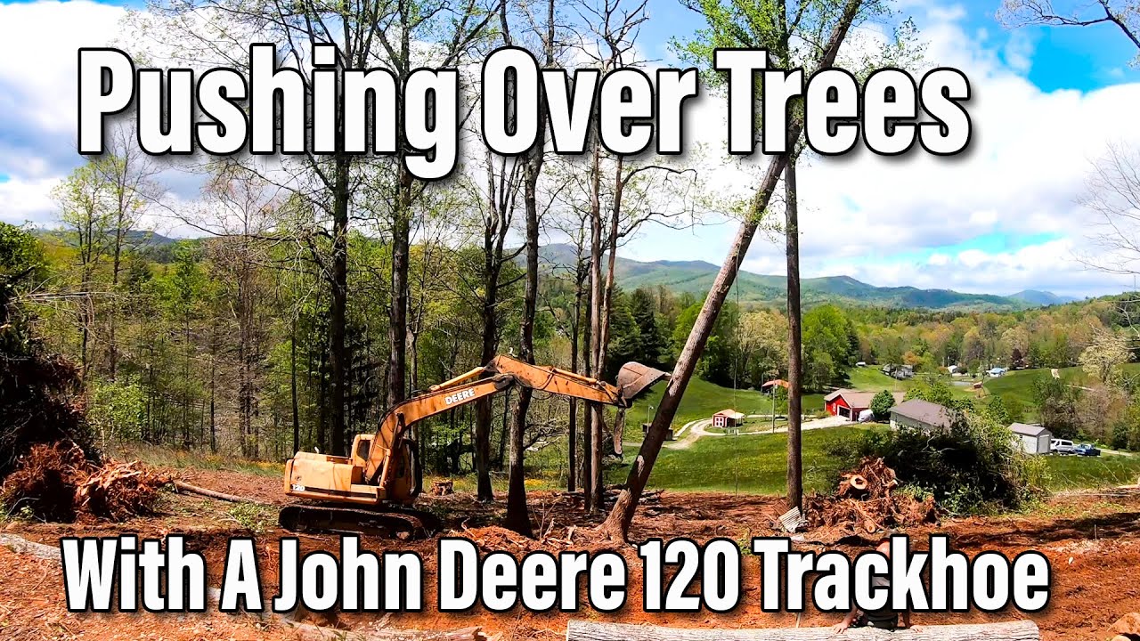 Pushing Trees Over with A John Deere 120 Trackhoe