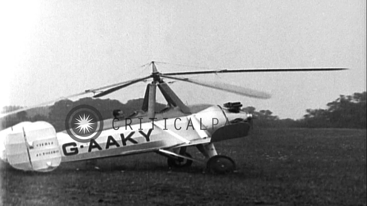 Pilot Juan de la Cierva disembarks autogyro and demonstrates his flight over the ...HD Stock Footage
