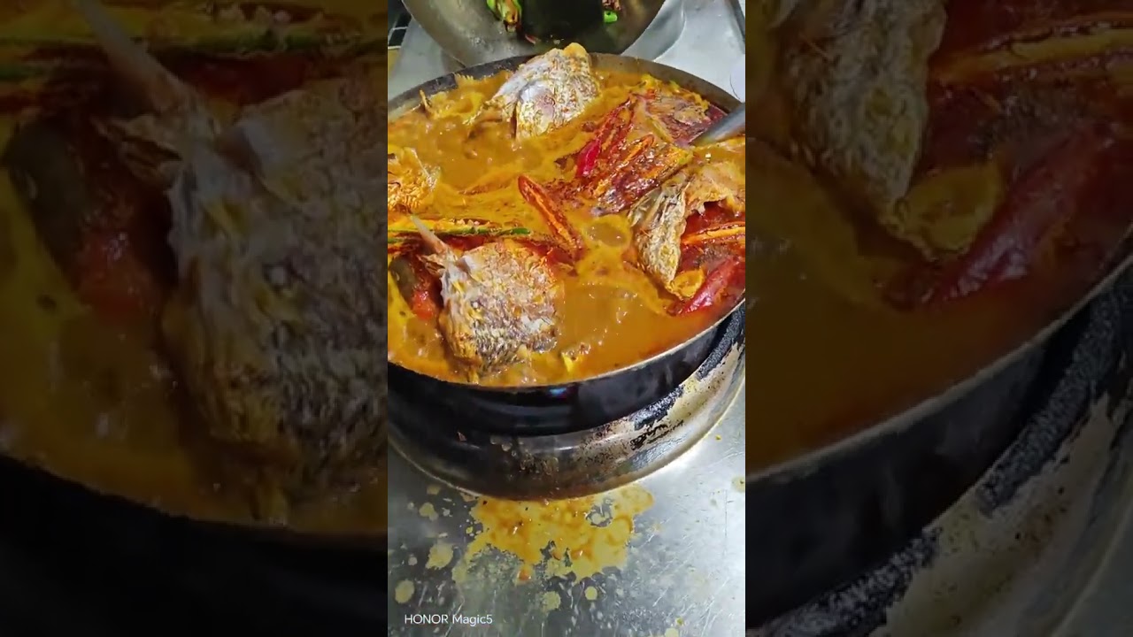 Delicious food in the world. Fish curry in a big pan