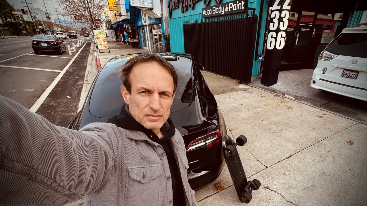 Riding electric skateboard Reseda Boulevard dropped off Tesla at auto body shop after accident