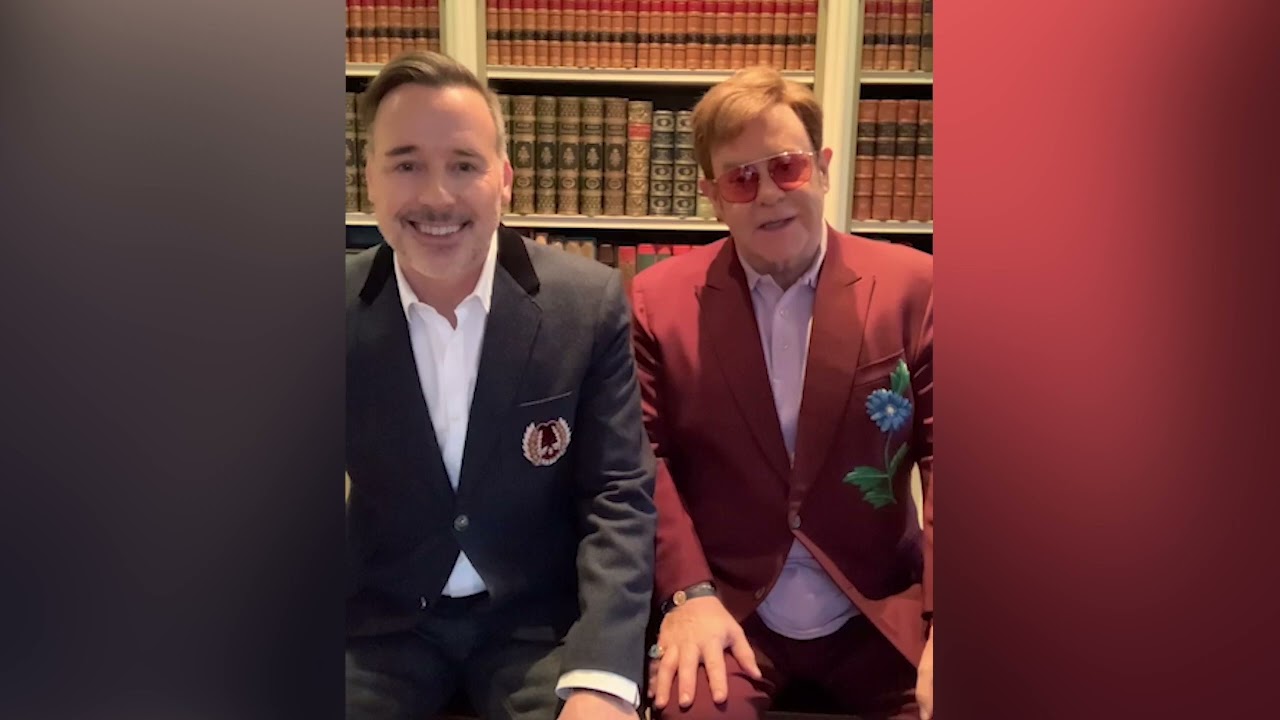 Sir Elton John and David Furnish sing to HIV/AIDS survivor