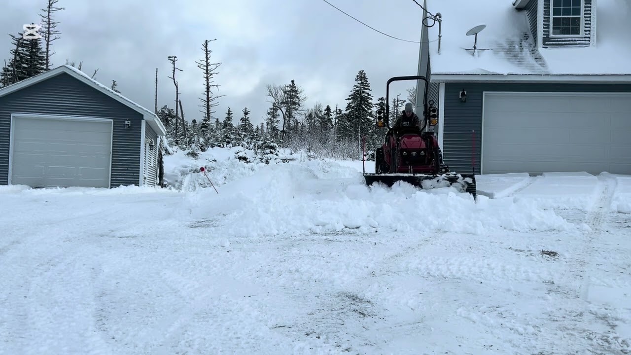 Tym plowing snow 