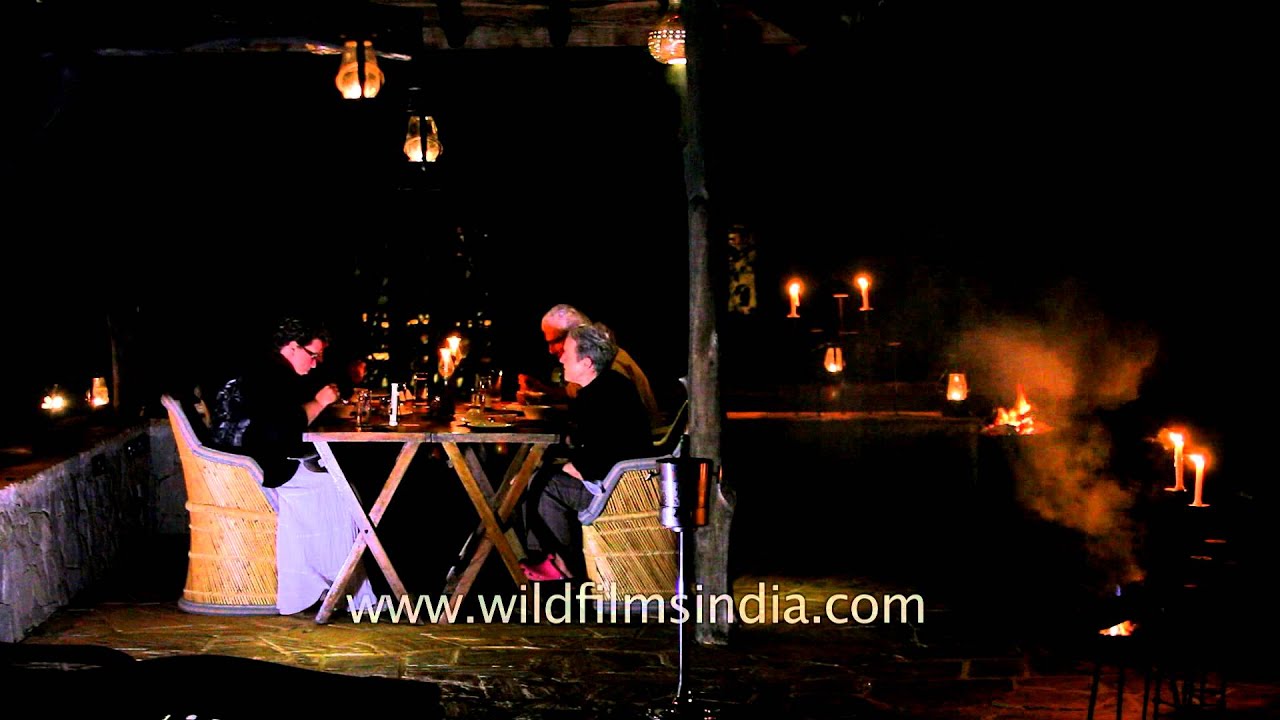 Visitors dining under the open sky at Kanha Earth Lodge
