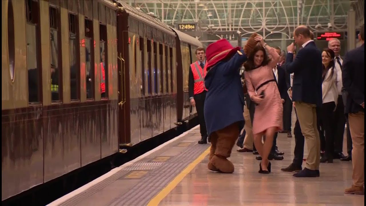 Princess Kate dances with Paddington Bear at London train station