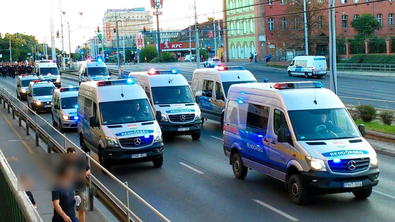 Football fans with massive police escort