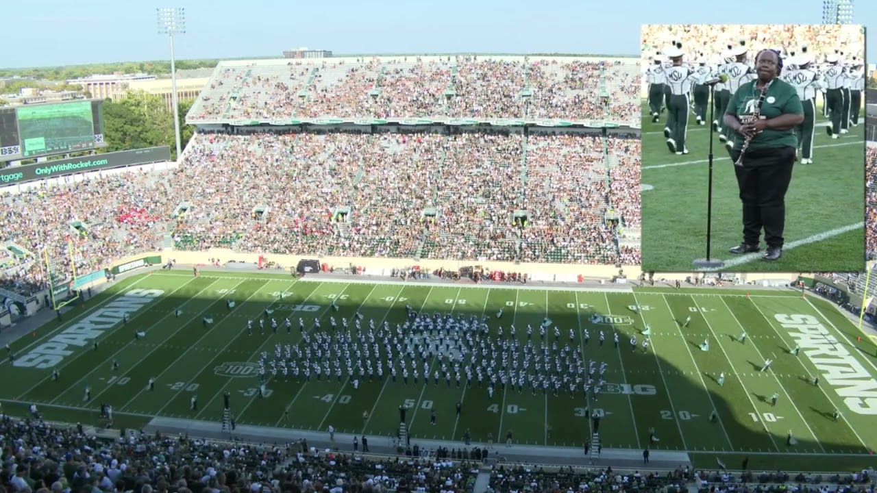 DOREEN CATCHES FEVER during MSU HALFTIME performance. 