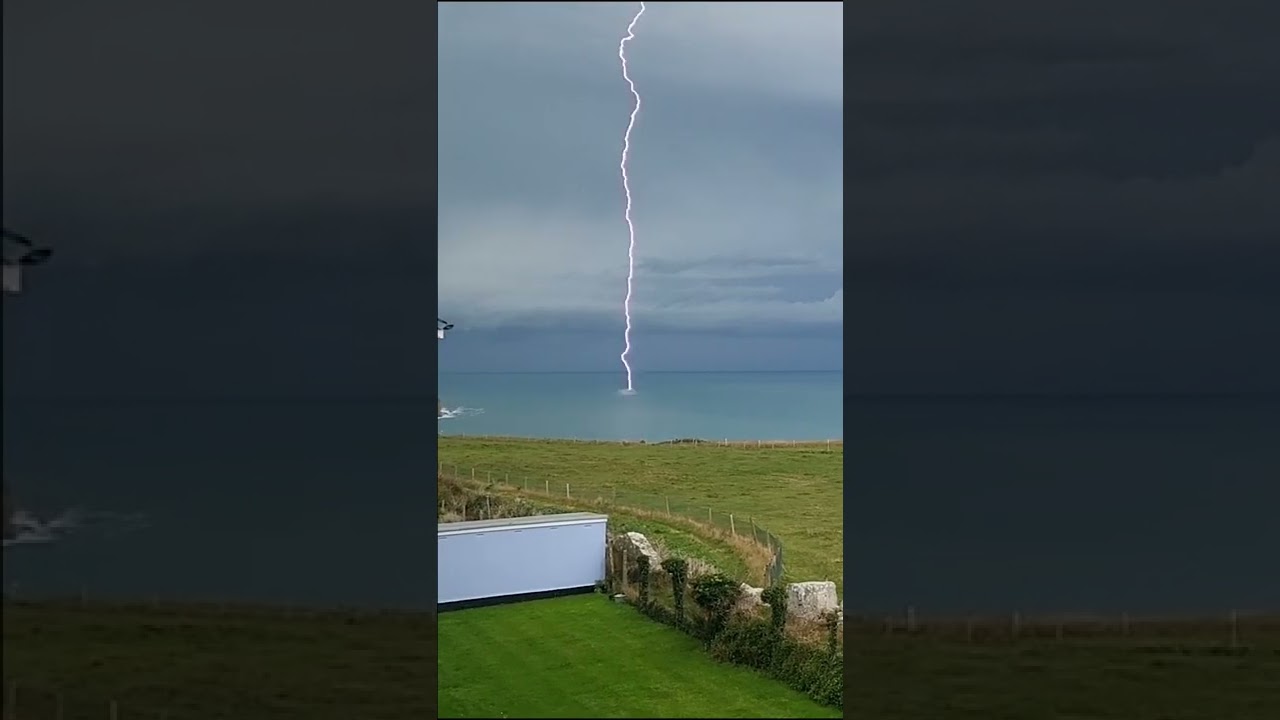 Rare footage shows moment lightning bolt slams into the sea off the English coast | SWNS