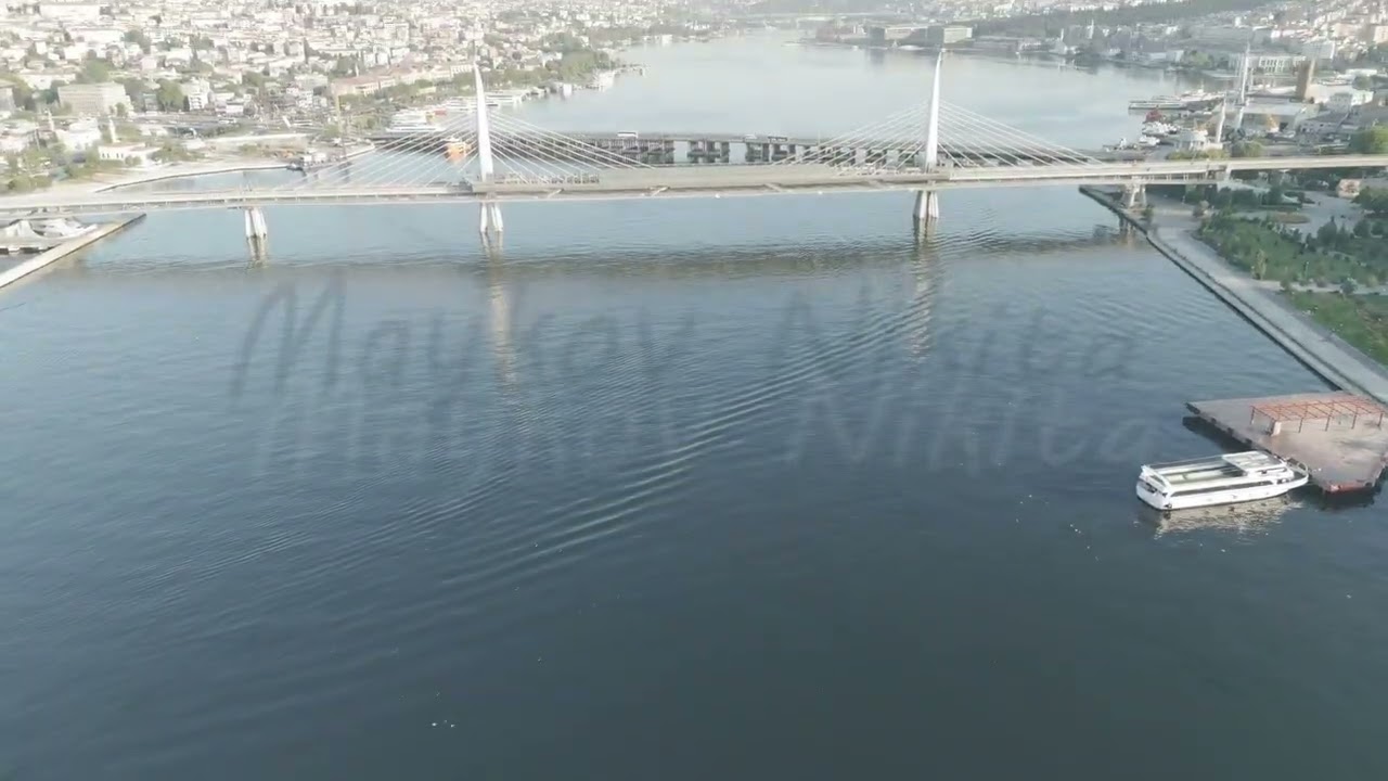 D-Log M. Istanbul, Turkey. Modern architecture of Golden Horn Metro Bridge and Halic Station pede...