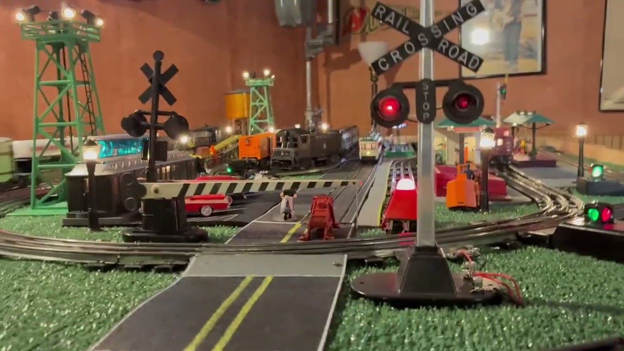 New York Central NW2 and RS-3 with Trolley navigating a 4X8 board.