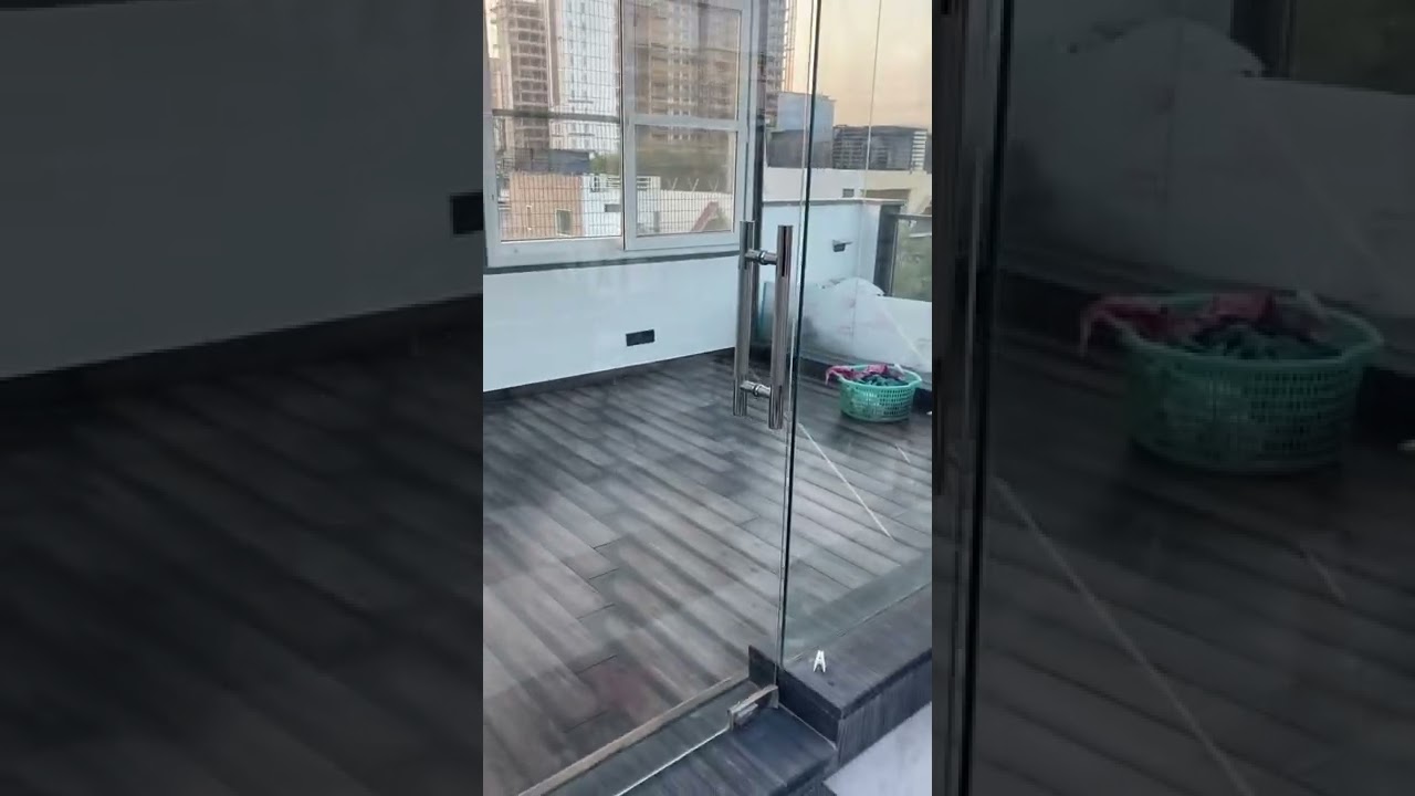 gym area on terrace with glass partition and Door