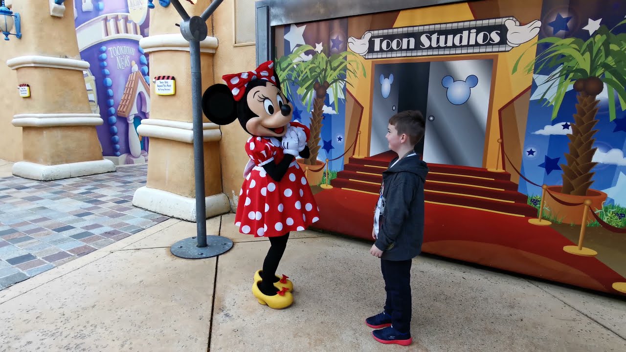 Giving Minnie Mouse a treat