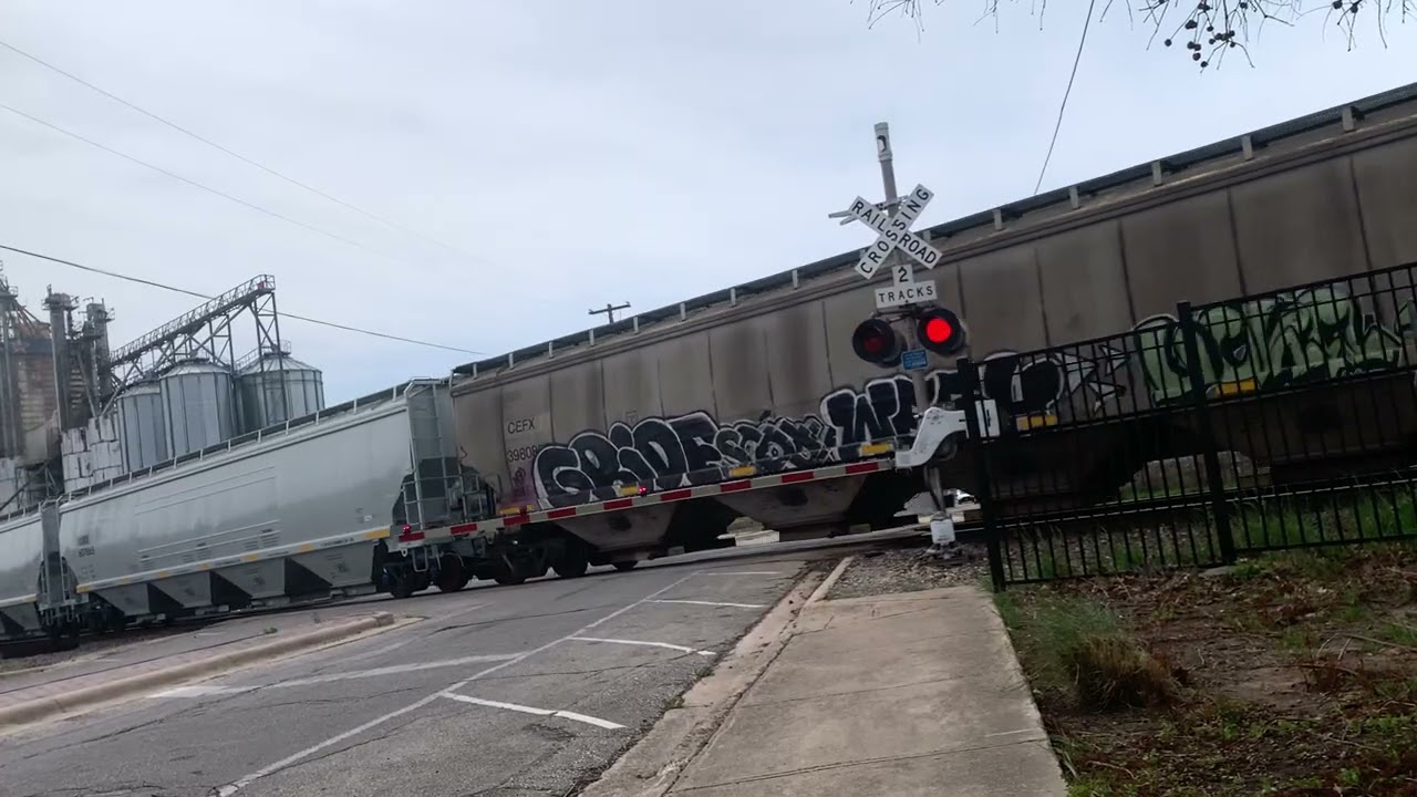 Northbound KCSM grain train at Main Street in Temple Texas on 3/16/26