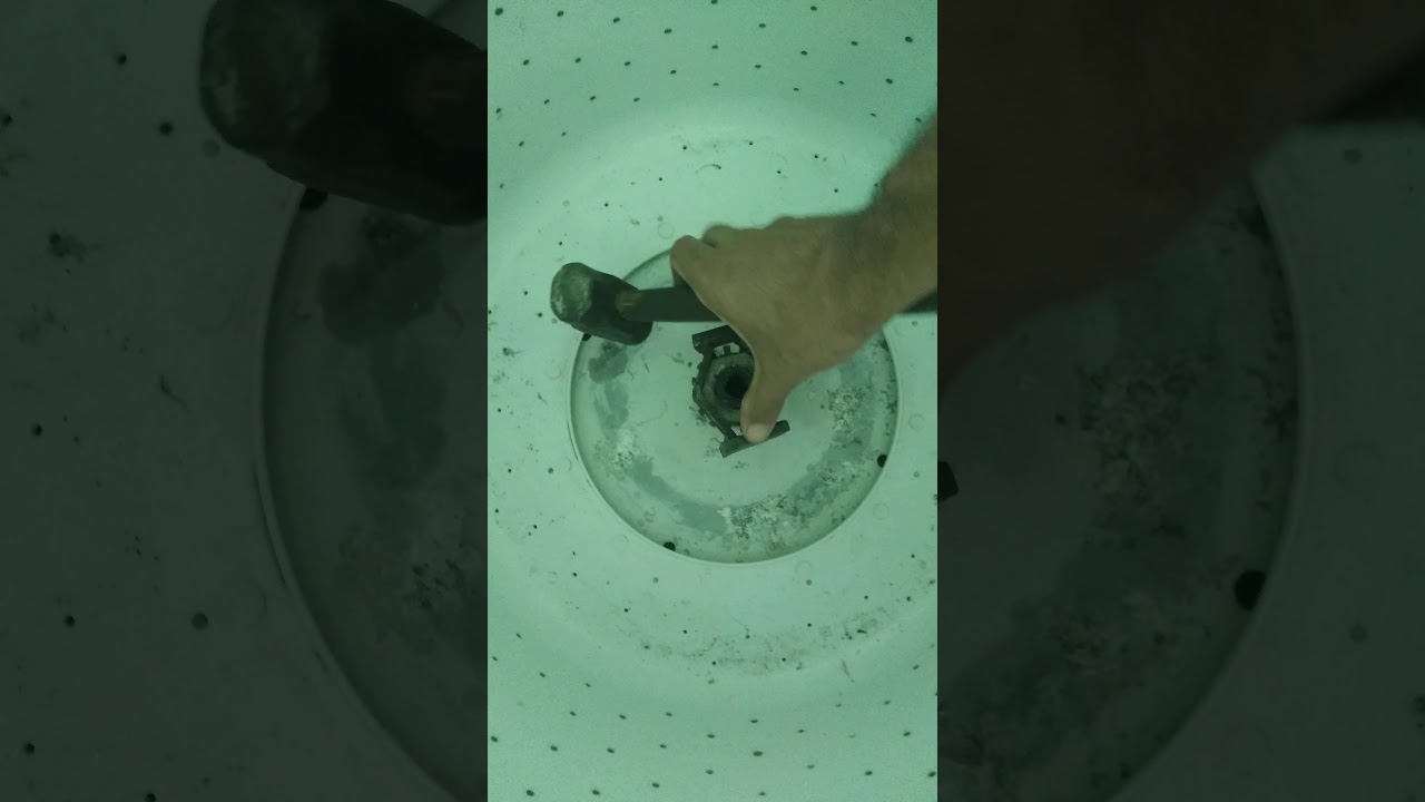 como tirar a porca do cesto da ge