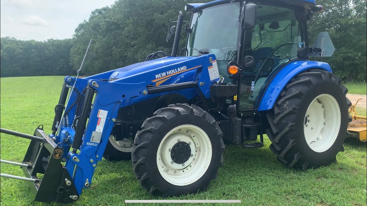 Feeding the Horses and Cows with New Holland Workmaster 75