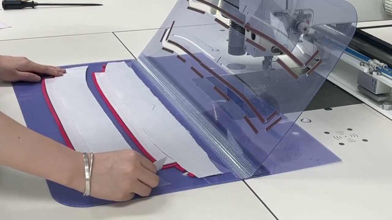 Lower Collar Band Sewing & Cutting using template sewing machine with Oscillating knife.