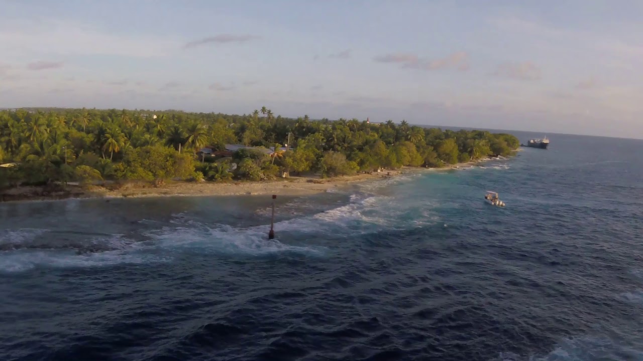 Oceania Marina Sails Through Tiputa Pass, Rangiroa Atoll, French Polynesia; Timelapse of Sunset