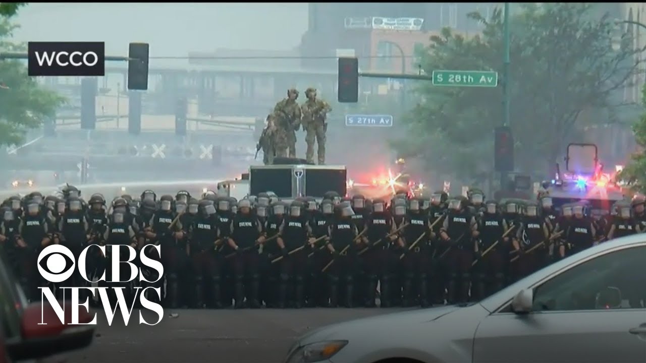 Police hold a line in Minneapolis amid protests