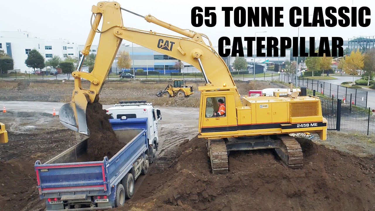 Cat 245B Loading Trucks