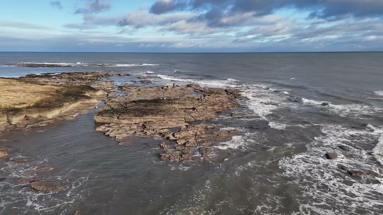 Spotting anglers at Newbiggin by the sea. Northumberland uk. 