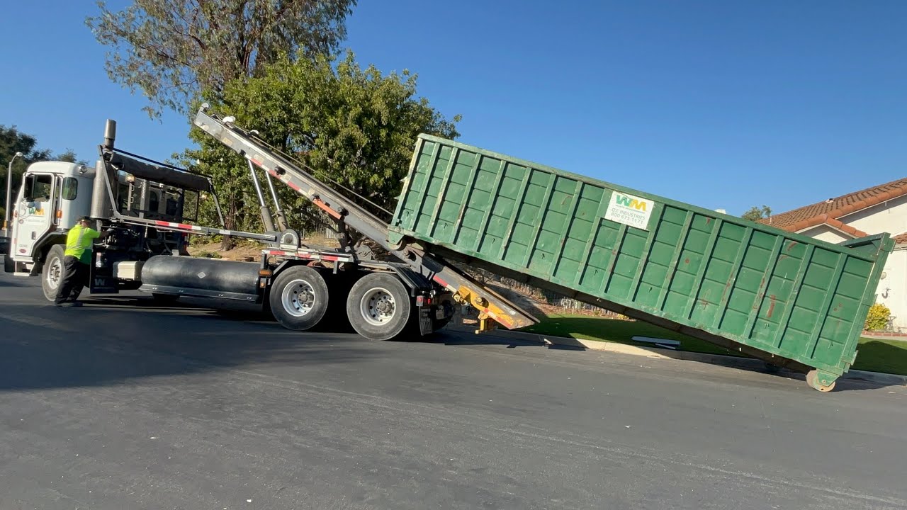 2018 Peterbuilt 320 Roll off truck in the late afternoon 