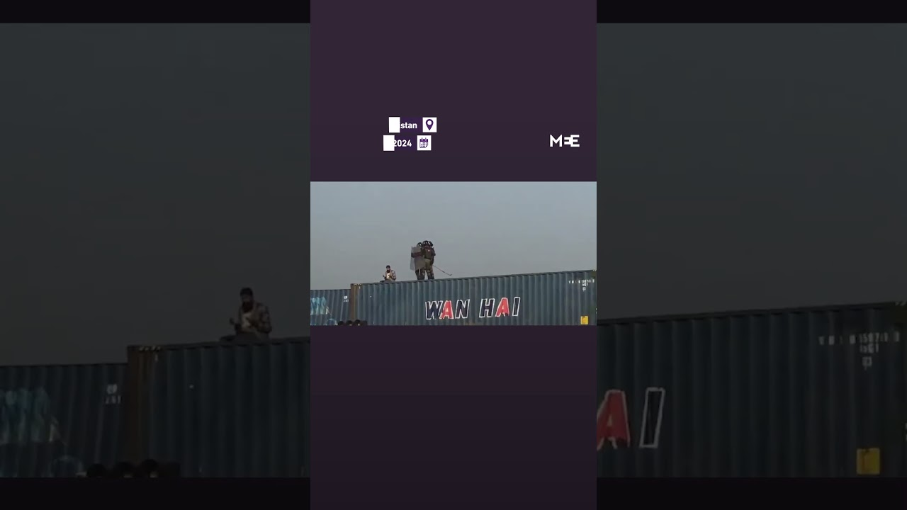 Pakistani security forces push praying pro-Imran Khan protester off seven-metre-tall container stack