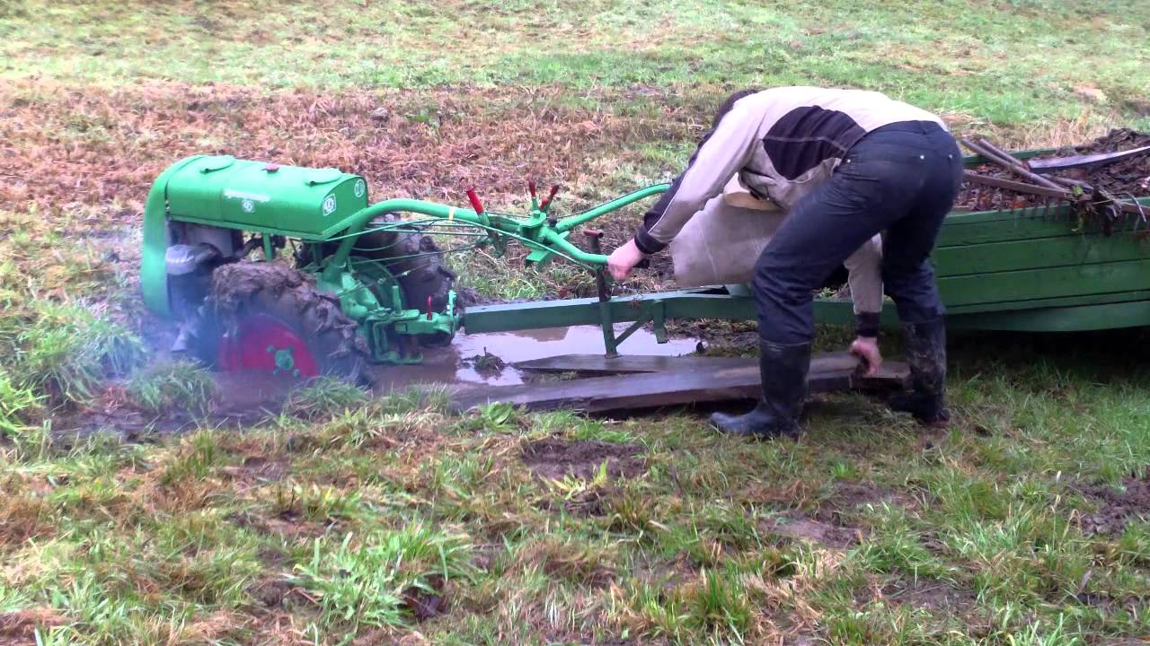 Two wheel tractor stuck in mud