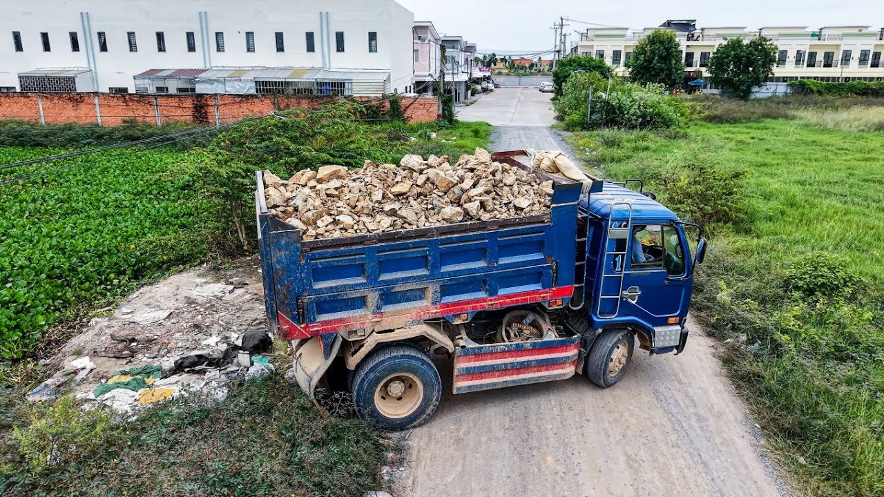 Excellent Skilllful Driver 5Ton Dump Trucks Unloading Stone & DOZER KOMATSU D21P Pushing Clear land