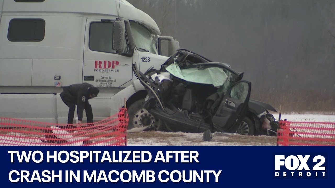 Vehicle sandwiched between semi-trucks in Macomb County