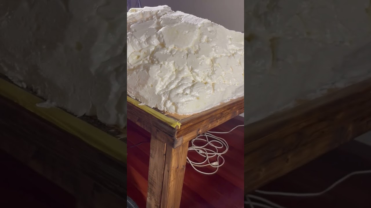Making model mountain using spray foam. 