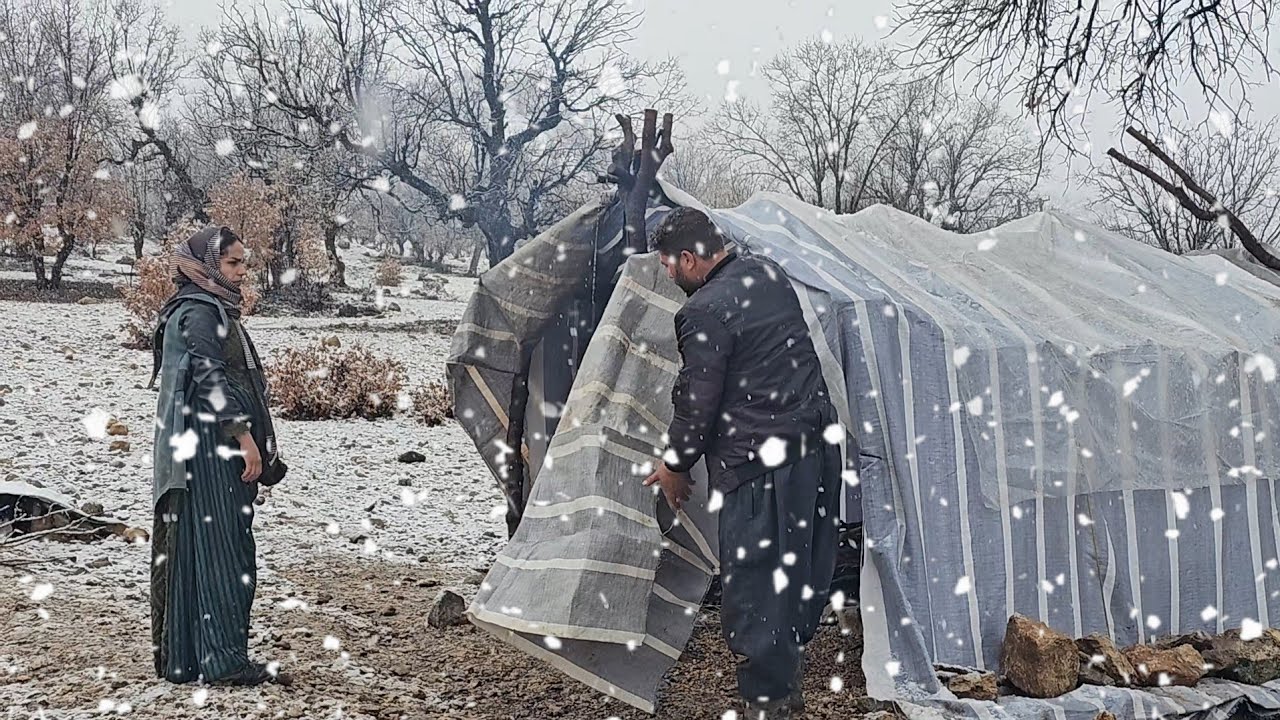 A snowy day in the life of Iranian nomads ❄️ | Baking local bread in the rain and mountains