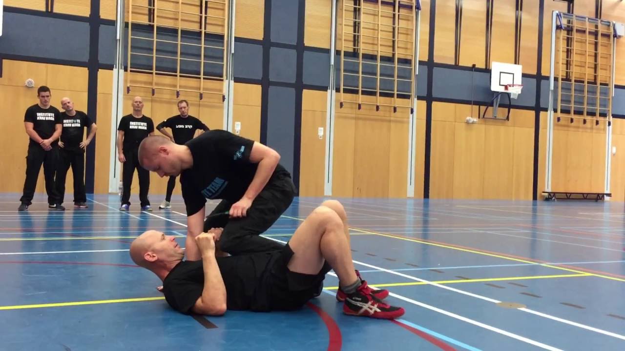 Defense against a knife attack with knee on chest with Amnon Darsa at Institute Krav Maga.
