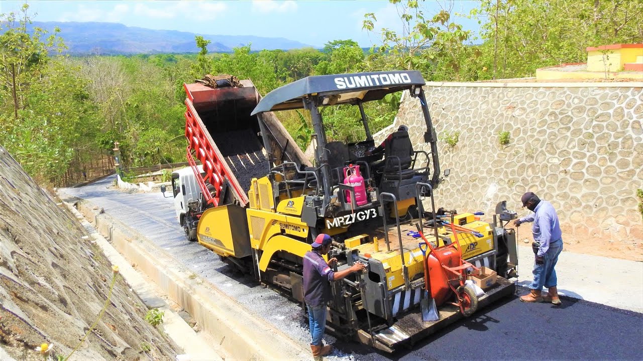 Asphalt Paving Construction On The Steep Driveway