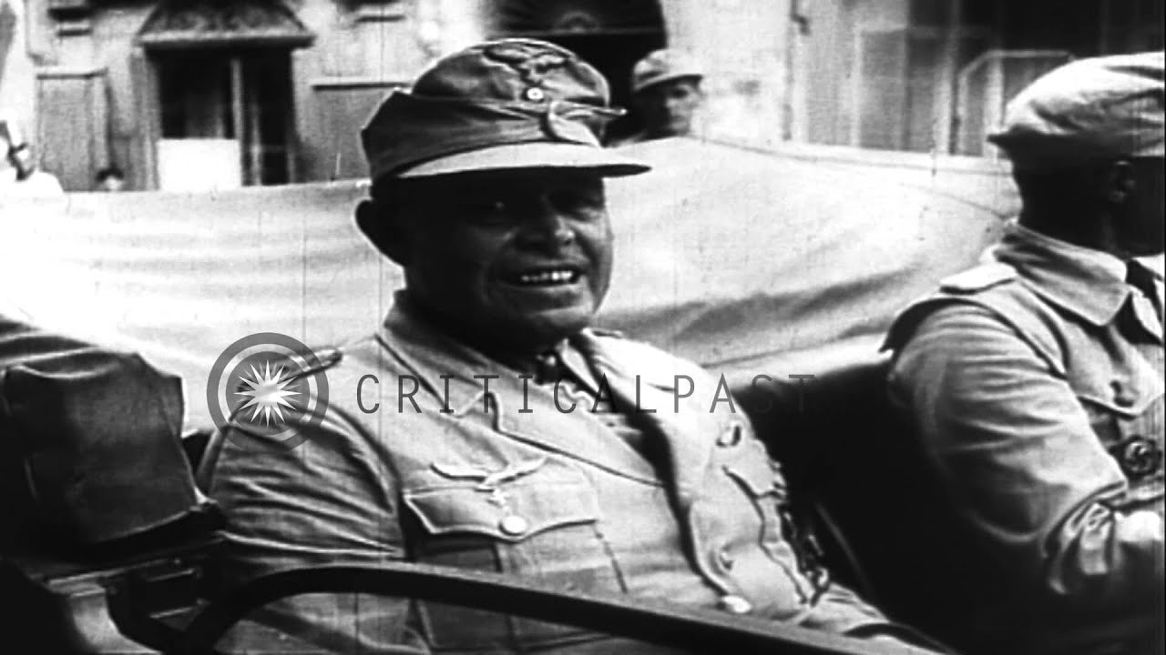 General Albert Kesselring  and  German officers arrive as gun crew adjusts artill...HD Stock Footage
