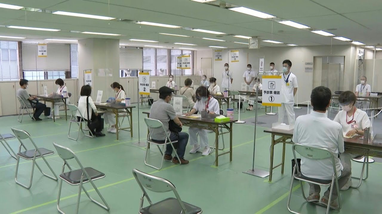 Japan opens mass vaccination centres ahead of Olympics | AFP