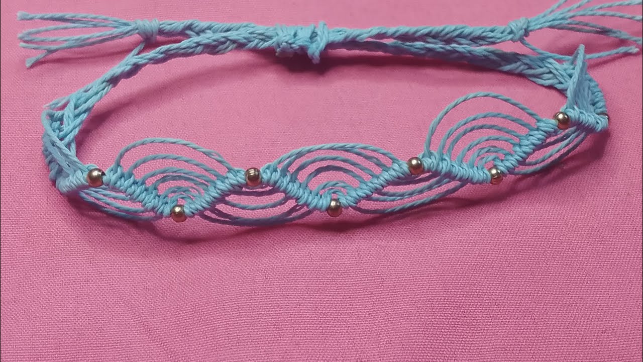 Handmade blue macrame bracelet with golden beads 