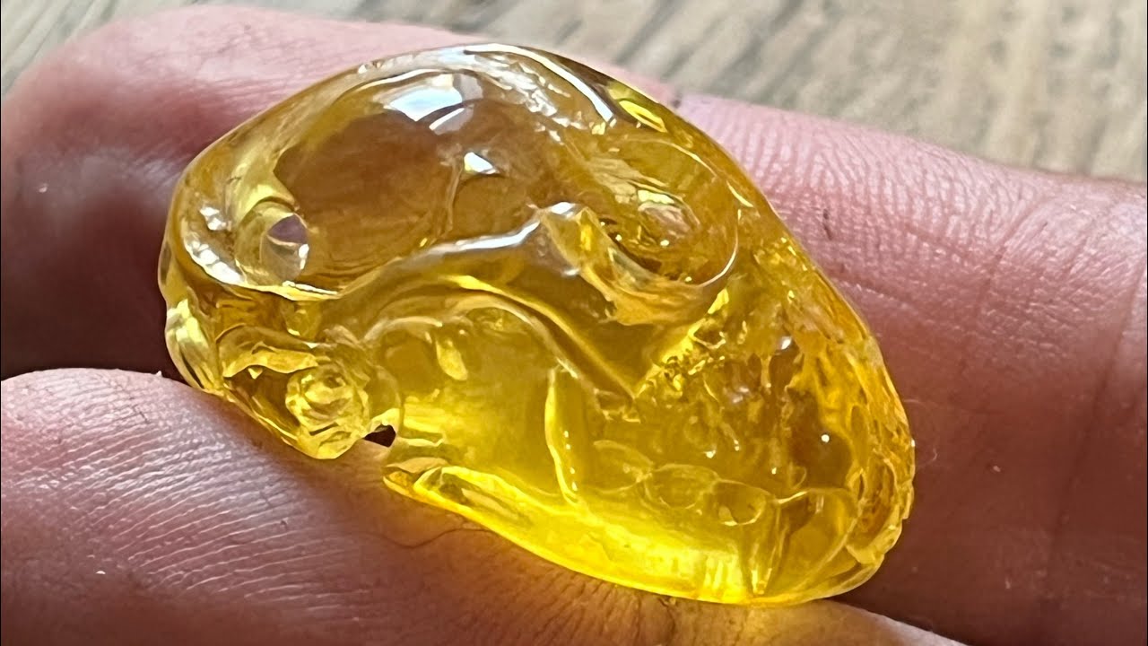 Carving an Amber cat skull.