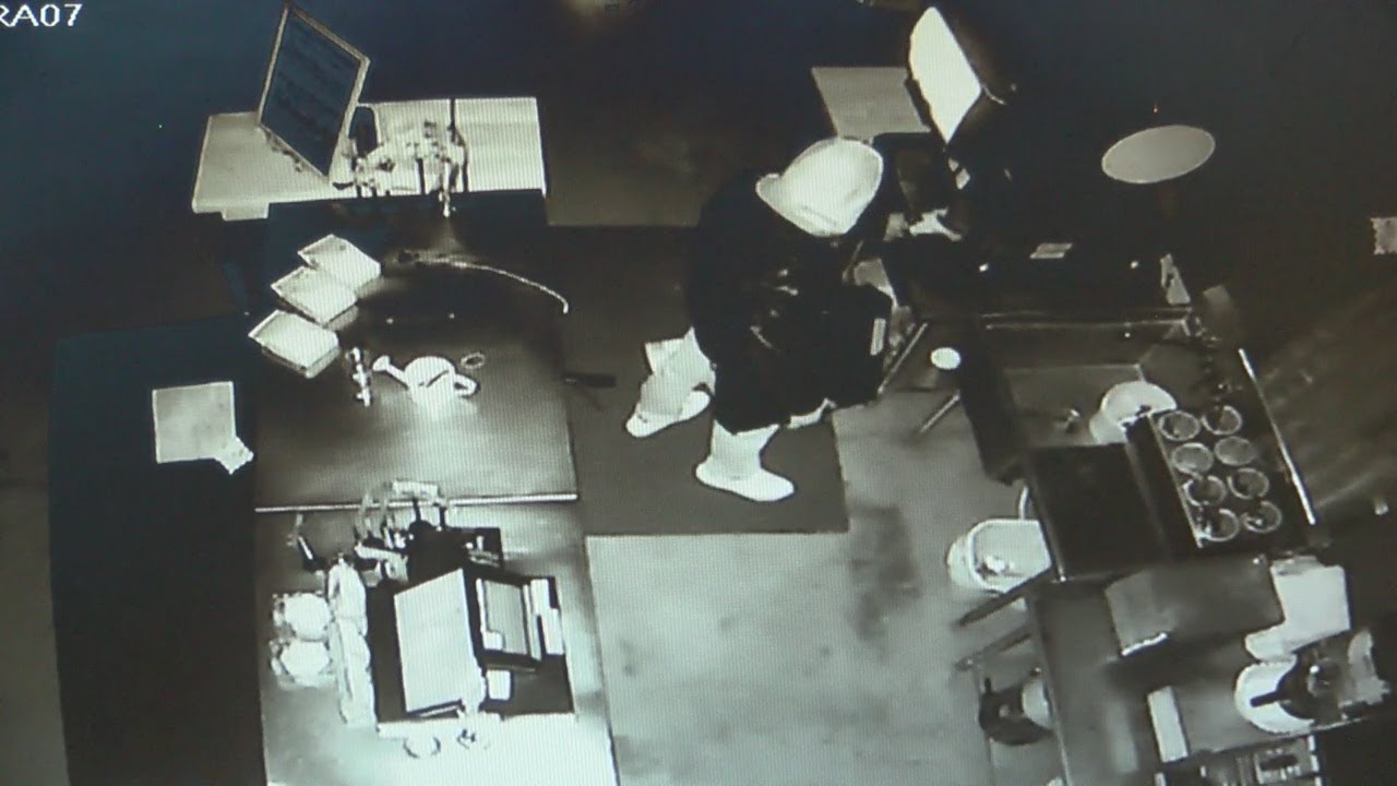 Video: Vandal breaks into cafe, pours a drink before fleeing